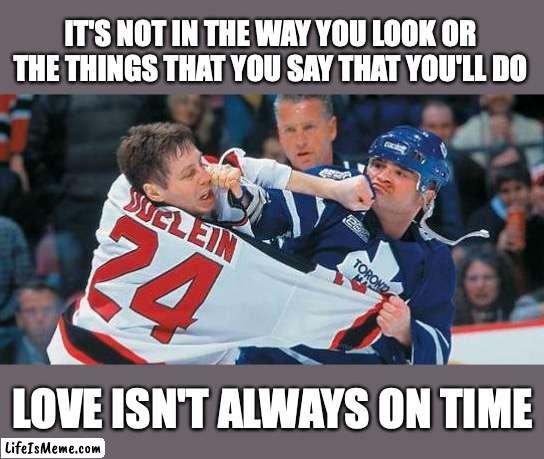 Toto |  IT'S NOT IN THE WAY YOU LOOK OR THE THINGS THAT YOU SAY THAT YOU'LL DO; LOVE ISN'T ALWAYS ON TIME | image tagged in toto,hockey,music | made w/ Lifeismeme meme maker