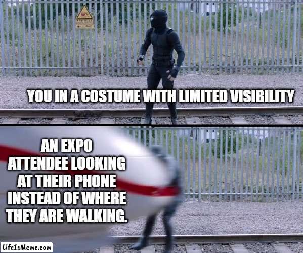 Hit by train | YOU IN A COSTUME WITH LIMITED VISIBILITY; AN EXPO ATTENDEE LOOKING AT THEIR PHONE INSTEAD OF WHERE THEY ARE WALKING. | image tagged in hit by train,spiderverse,costume,cosplay,visibility,distracted driving | made w/ Lifeismeme meme maker