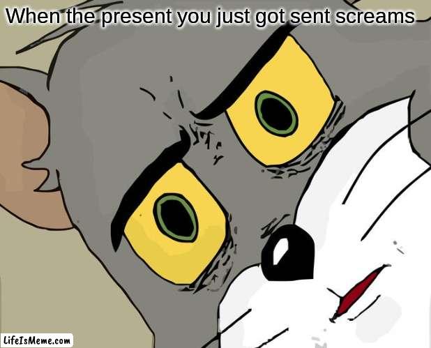 Hmmmmmmm whats in there | When the present you just got sent screams | image tagged in memes,unsettled tom | made w/ Lifeismeme meme maker